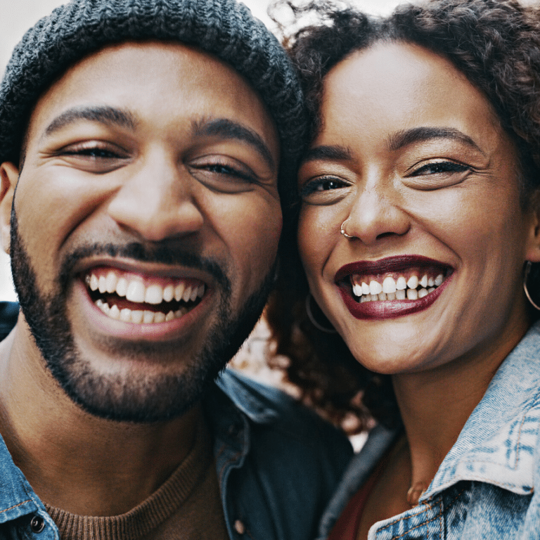 African American couple smiling gleefully