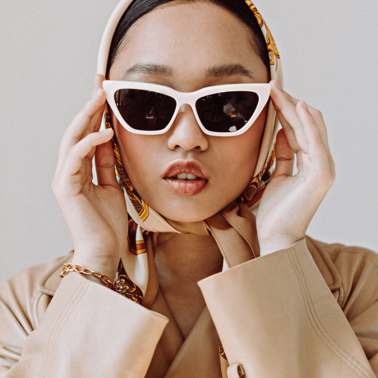 fashionable Asian woman wearing large white sunglasses