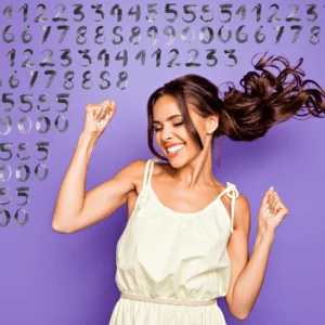 smiling brunette woman dancing around joyfully against a purple backdrop of numbers