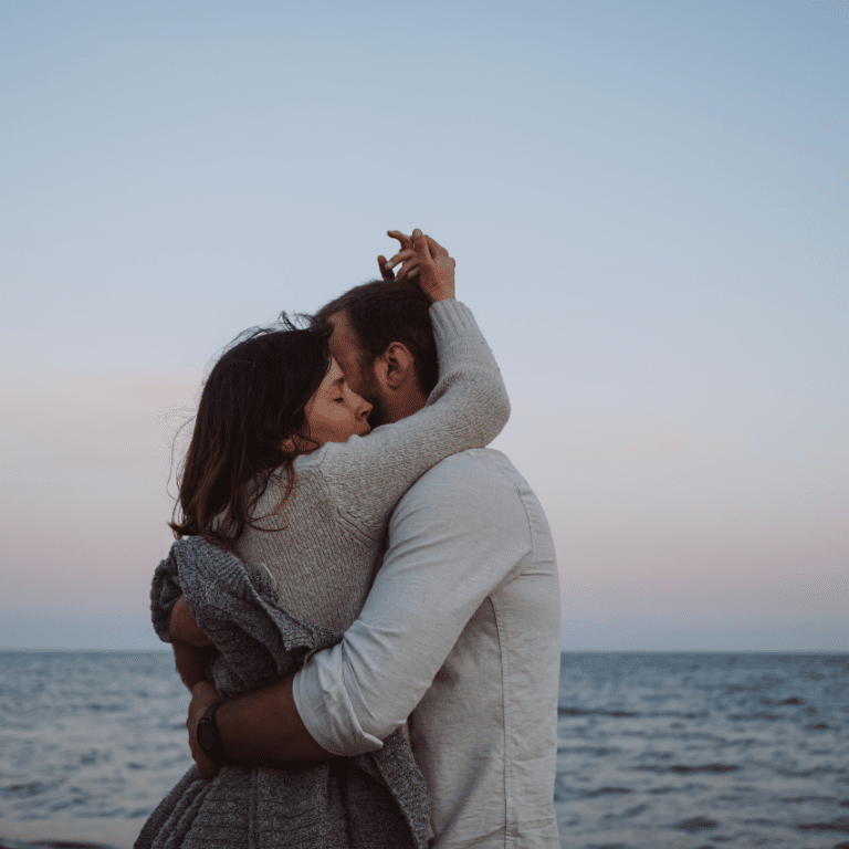 couple on a beach embracing each other