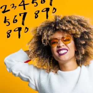 smiling woman with orange glasses and white sweatshirt against yellow background with black numbers floating above her
