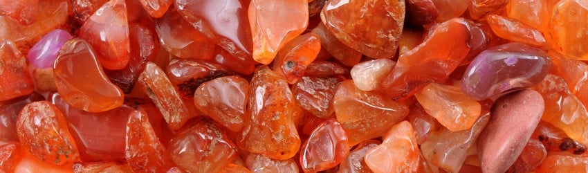 Orange carnelian crystals in a big pile.