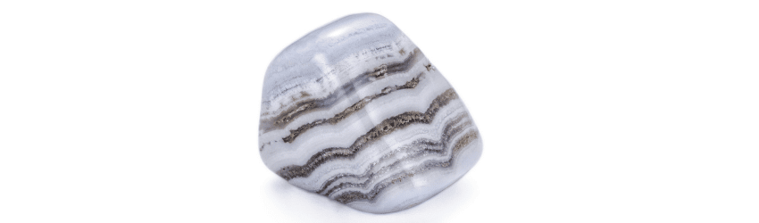 A tumbled blue lace agate crystal on a white background.