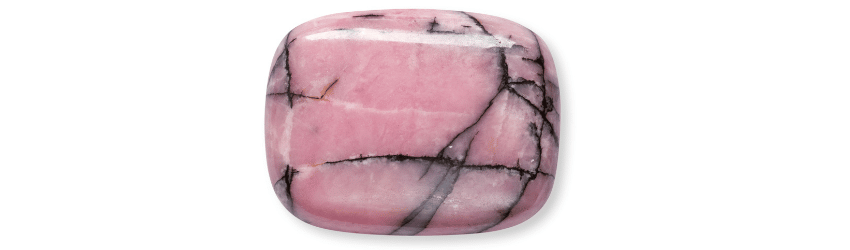 A pink Rhondonite stone on a white background.