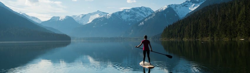 woman-balancing-on-paddle-board