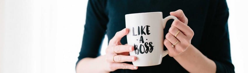 hands holding a mug that says like a boss