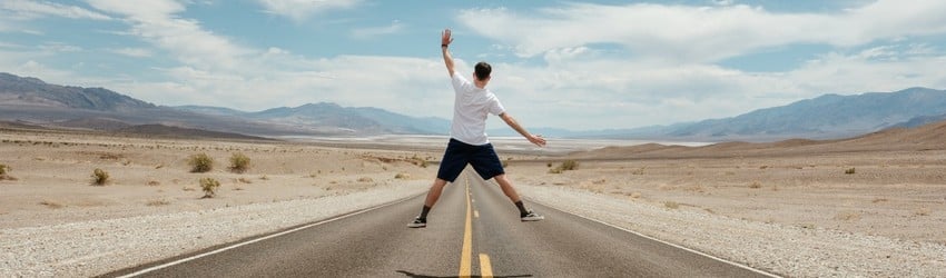 man-jumping-up-on-road