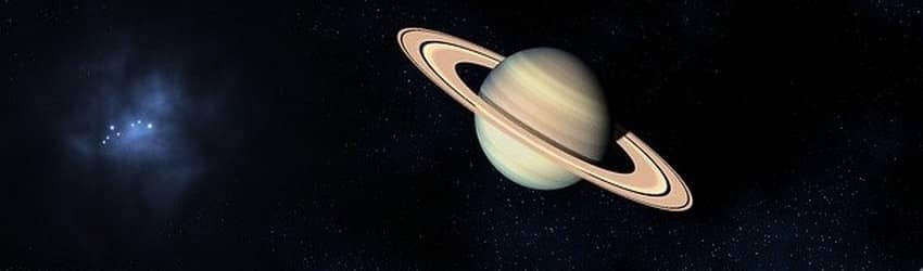The planet Saturn in dark space.