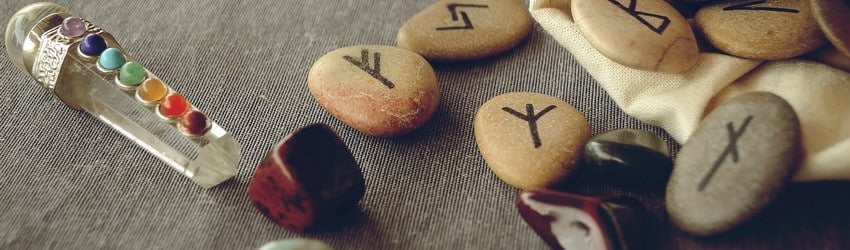 rune stones with crystals on table