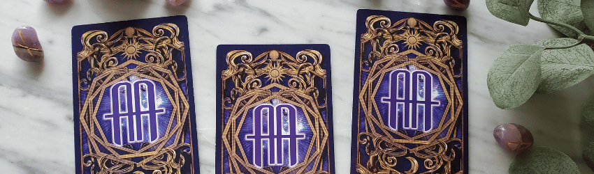 A sample 3-card Tarot spread featuring purple astrology answers Tarot cards.