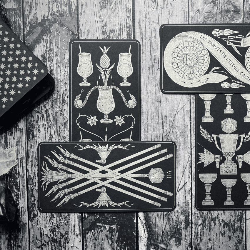 A sample 2-card cross Tarot spread featuring black and white Tarot cards.