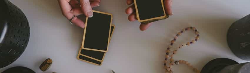 woman-holding-tarot-cards