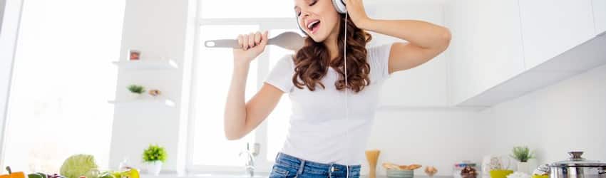 woman singing in kitchen