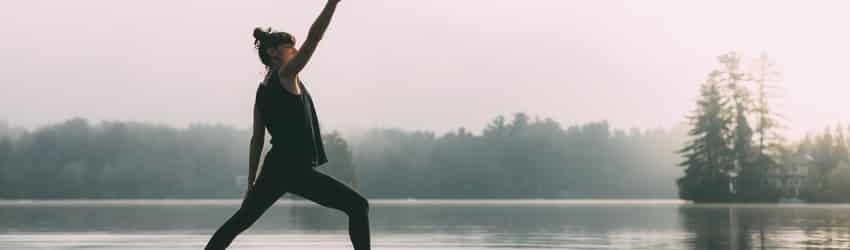 woman-stretching-on-paddleboard