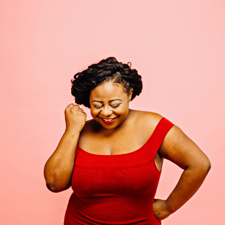 excited woman in a red dress smiling