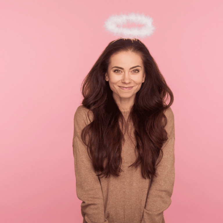 smiling brunette woman with an angel halo above her head