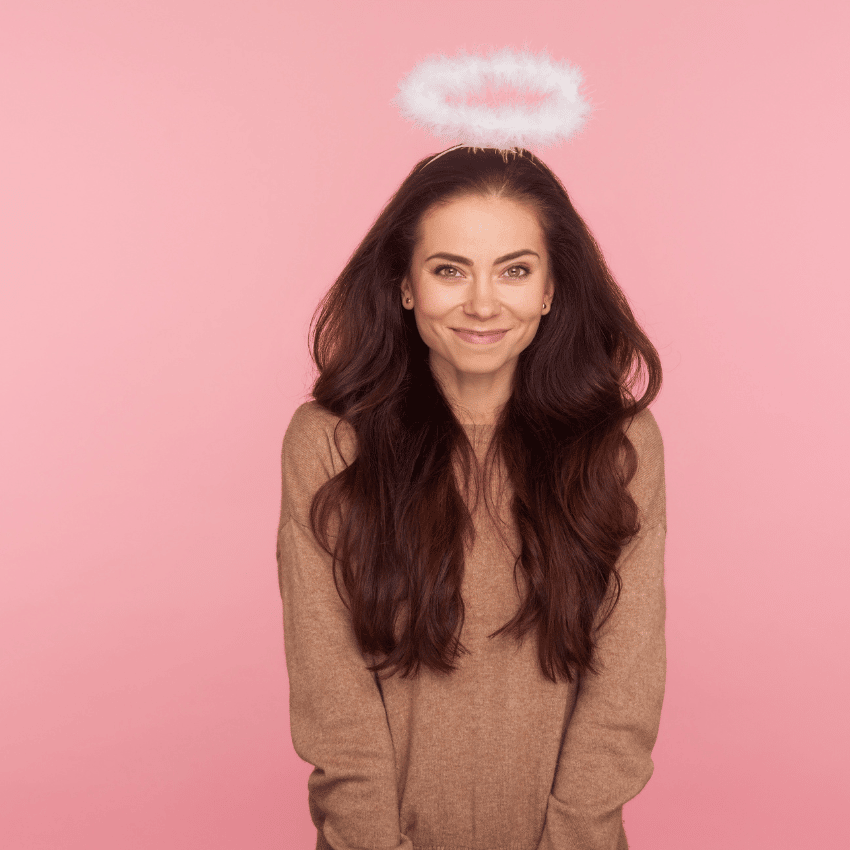 smiling brunette woman with an angel halo above her head