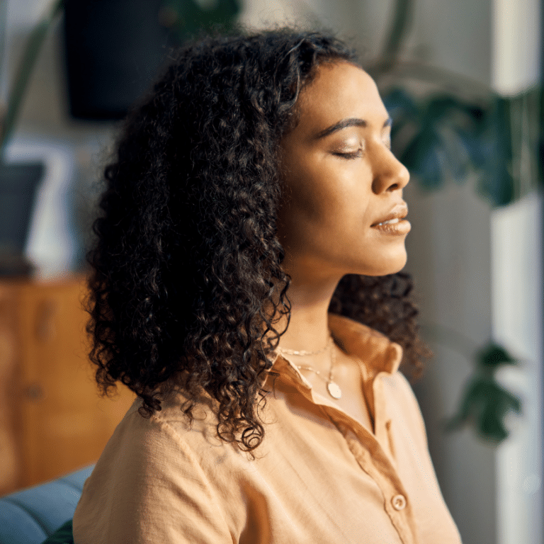 woman with her eyes closed in meditation