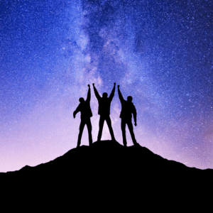 three people standing on a mountain top with their arms outstretched against a purple and pink starry night