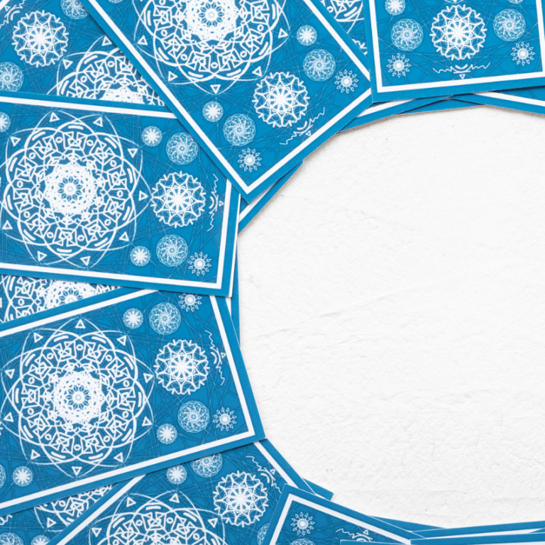 blue tarot cards spread out against a white background