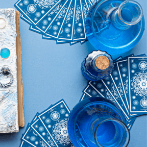 an array of blue tarot cards spread out on a blue table