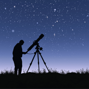 man standing against a backdrop of a purple starry night with a telescope