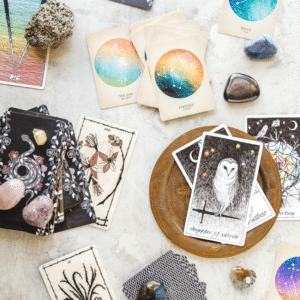 array of different tarot cards spread out on a white table