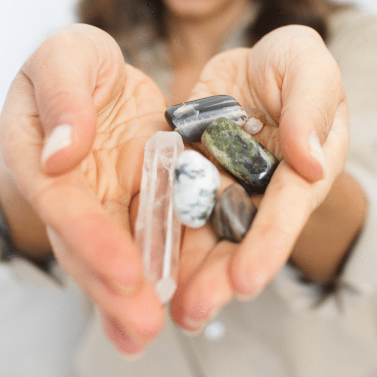 hands holding out an array of different crystals