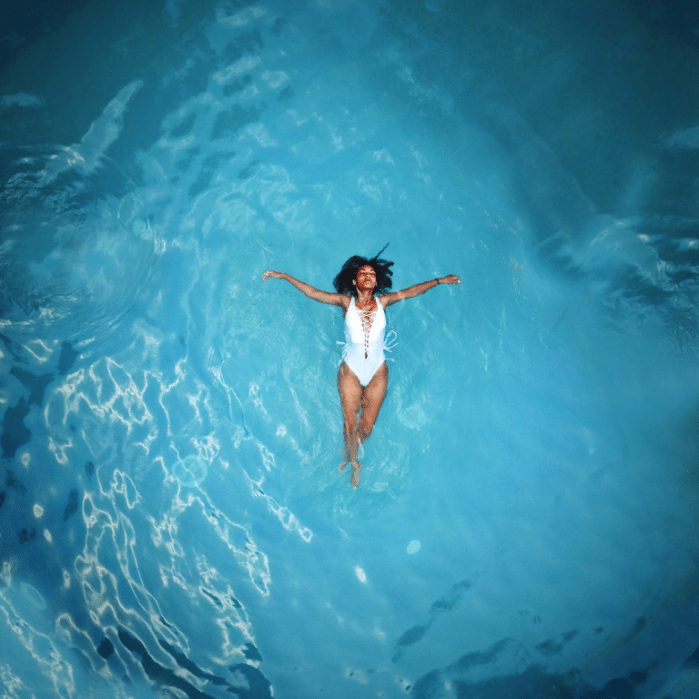 woman floating in a large pool of water