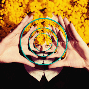 A woman in a mirror is shown with multiple mirrors, showing many different reflections.