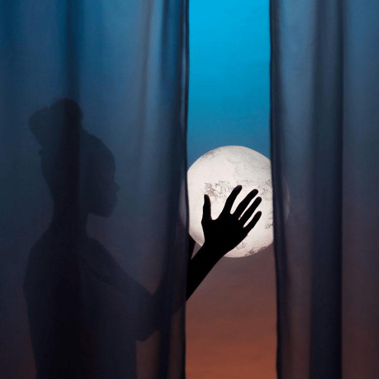 A woman holds a glowing orb representing the lunar energy for May 2026.